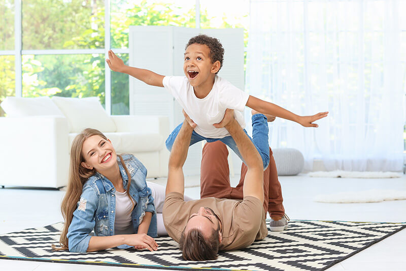 Happy family playing at home